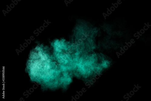 Aquamarine powder explosion on black background. Colored powder cloud. Colorful dust explode. Paint Holi.