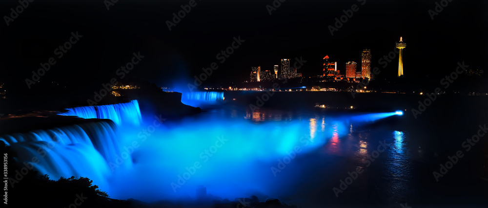 Niagara Falls dark night blue lights view to Canada Panorama. Waterfalls at the border of US state of New York and Canadian province of Ontario. Drains Lake Erie into Lake Ontario. Niagara Falls dark night blue lights view to Canada Panorama. Waterfalls at the border of US state of New York and Canadian province of Ontario. Drains Lake Erie into Lake Ontario.