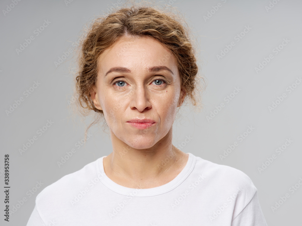 Pretty woman white t-shirt studio lifestyle emotions old age Pretty woman white t-shirt studio lifestyle emotions old age