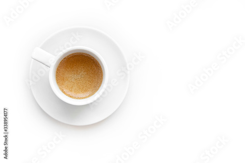 Top view of espresso coffee in white cup isolated on white background. 