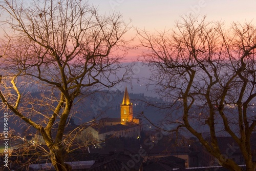 Sunset view on the hills surrounding Perugia, through tree branches