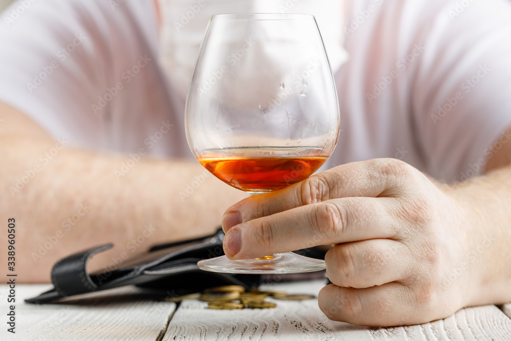 desperate man falls into depression and becomes alcoholic and miserable. His addiction leads him to a state of loneliness and poverty desperate man falls into depression and becomes alcoholic and miserable. His addiction leads him to a state of loneliness and poverty