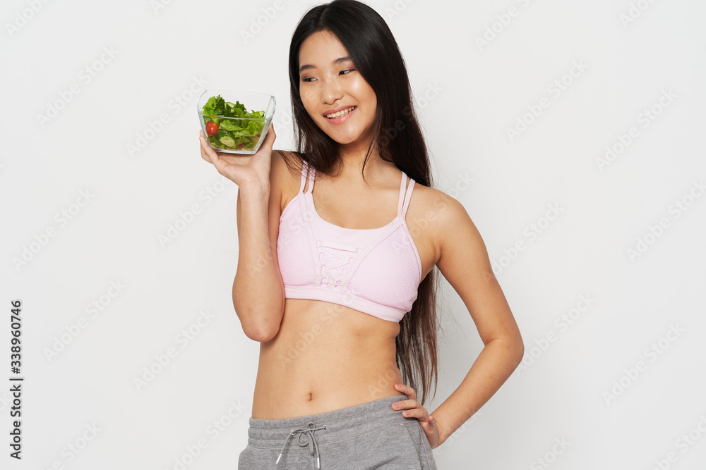 Cheerful woman slim figure salad meal smile Cheerful woman slim figure salad meal smile