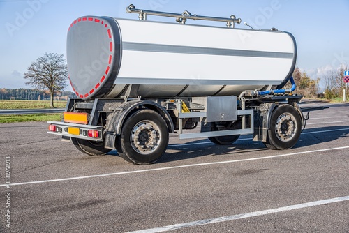 Car tank with milk . Trailer barrel, transportation of liquid goods