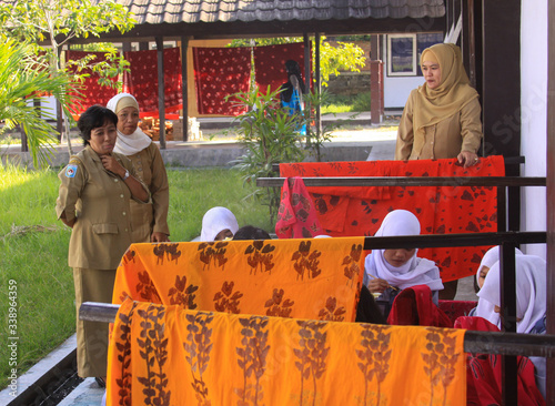Girls painting in batik school in Mataram Lombok