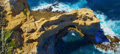 The Arch rock formation along the Great Ocean Road, Victoria - Australia. Aerial view on a sunny morning