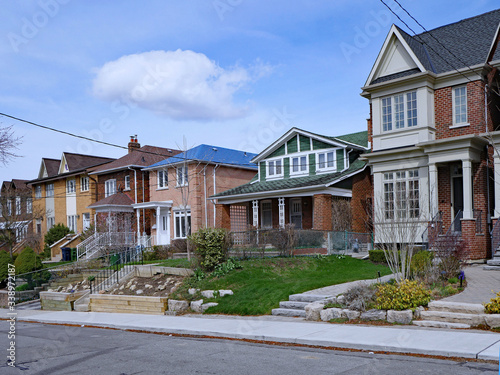 Photography Residential street with a variety of older and newer houses and a mix of detache