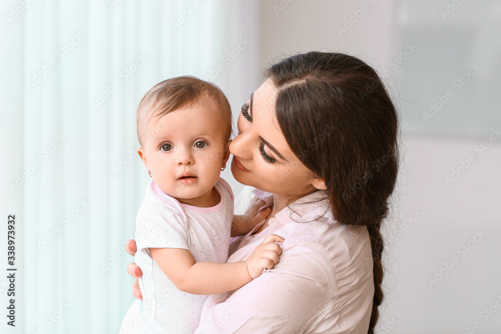 Happy mother with cute little baby near window Happy mother with cute little baby near window