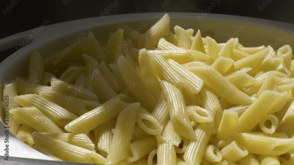 hot cooked pasta penne quils inside plastic strainer hot cooked pasta penne quils inside plastic strainer