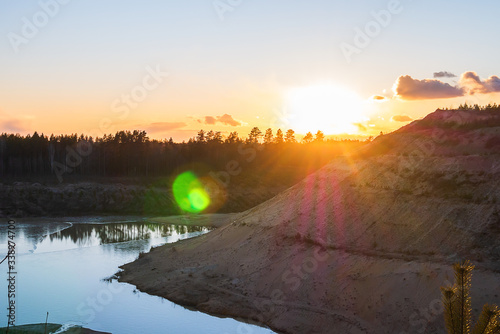 Sand mountains with small coniferous trees.