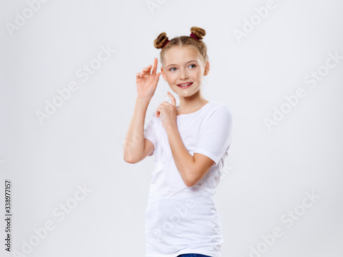 Cheerful girl pigtails lifestyle smile studio white t-shirt