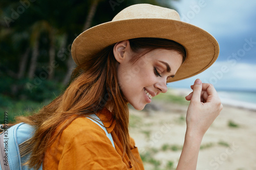 Woman tourist traveling vacation hat backpack fresh air