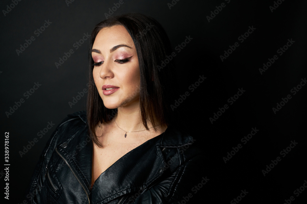 Beautiful Black hair woman beautiful portrait. Hairstyle curly hair beauty female model girl over dark background Beautiful Black hair woman beautiful portrait. Hairstyle curly hair beauty female model girl over dark background