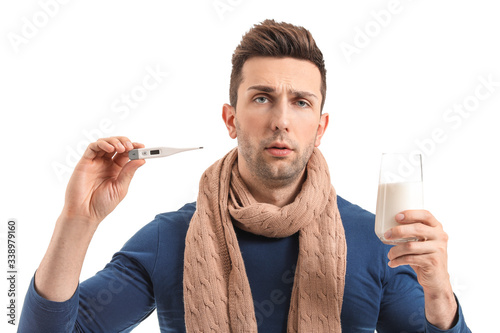 Young man ill with flu hold...