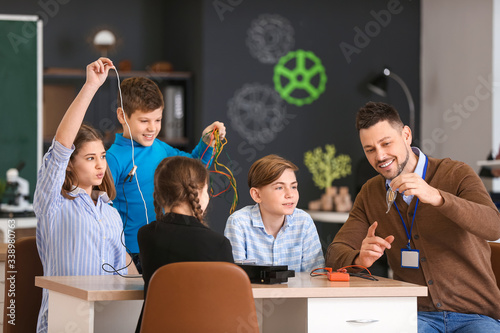 Teacher conducting physics ...