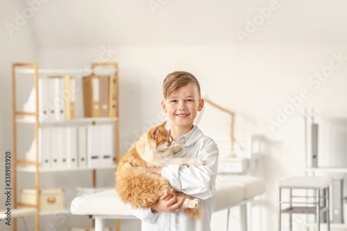 Little veterinarian with cu...