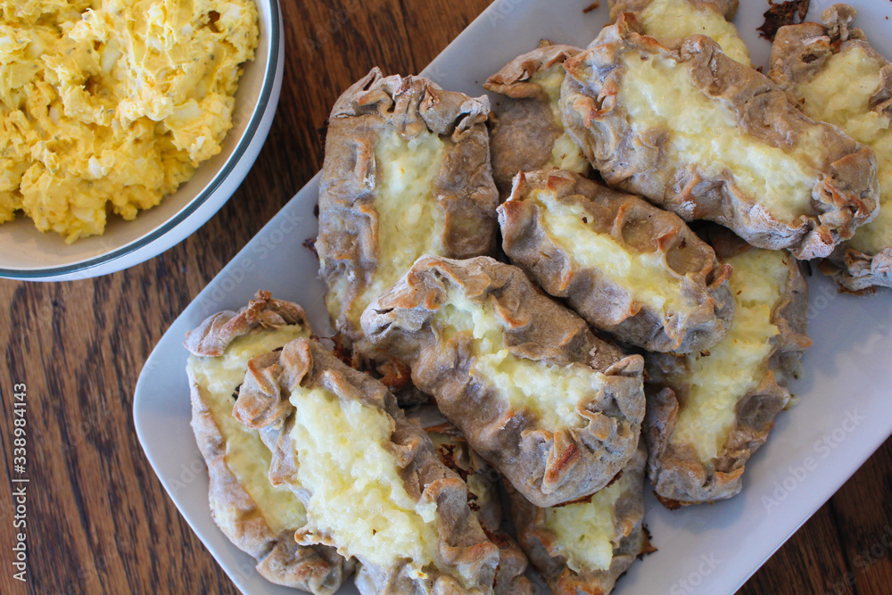 Close up view on freshly baked Karelian Pie with egg butter, a traditional topping to this dish in Finland