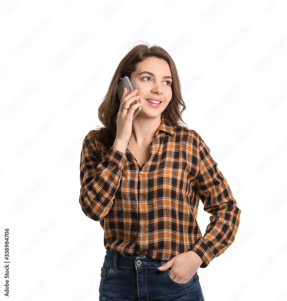 Beautiful young girl talking by phone on white background Beautiful young girl talking by phone on white background