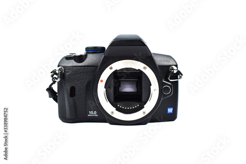 A black digital camera without a lens placed on top of a white background