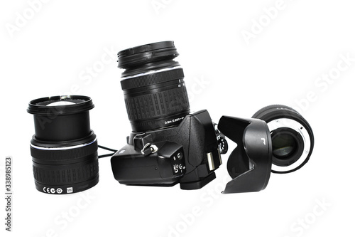Photo of three black colored lens of a digital camera while one is attached to it placed beside one another