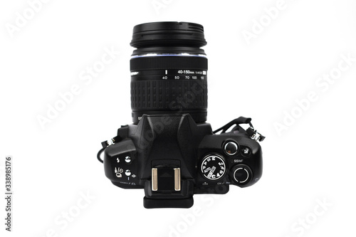 Side view of a black colored camera with lens attached to it on a white background