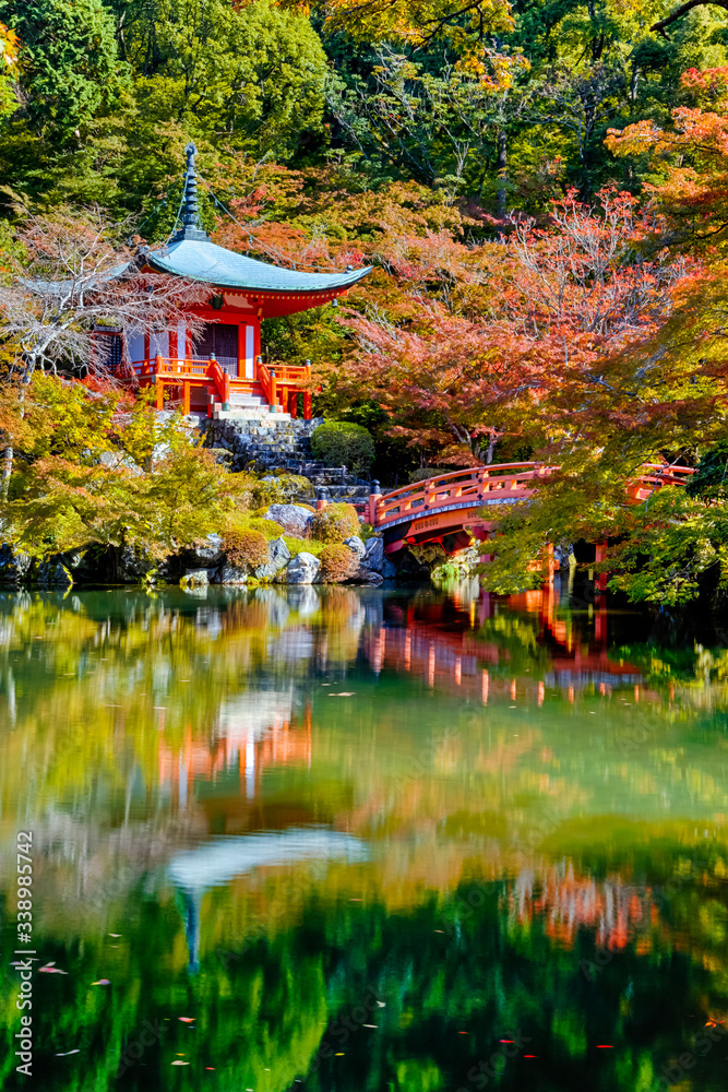 Naklejka premium Japanese Traveling. Famous Daigo-ji Temple During Beautiful Red Maples Autumn Season at Kyoto City in Japan. With Pond Reflections in Foregorund.
