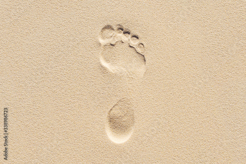 Footprint in the sand. Man on the planet. photo