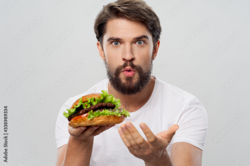 young man eating a sandwich young man eating a sandwich