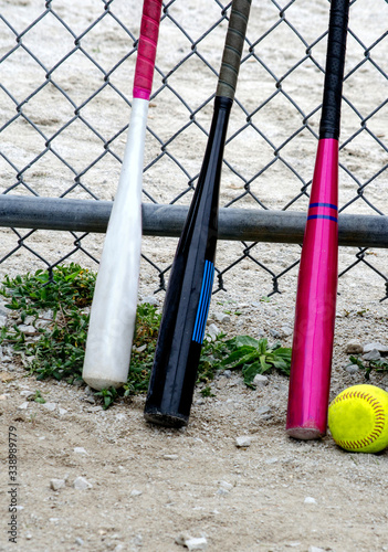  Baseball bats and a softball, Tools for a girls baseball game © Susan