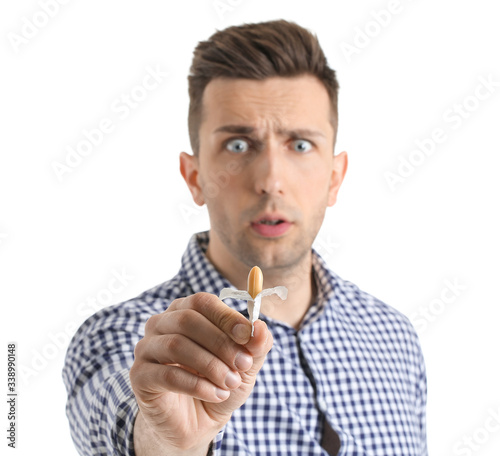 Young man with hemorrhoidal...