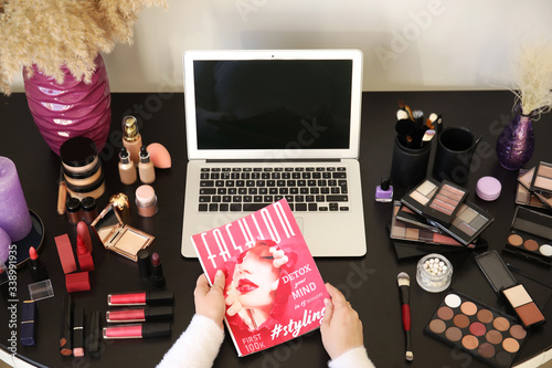 Makeup artist at table with...