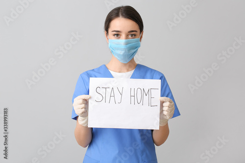 Doctor in medical mask hold...