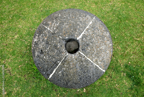 Big round millstone, top view, centered. photo