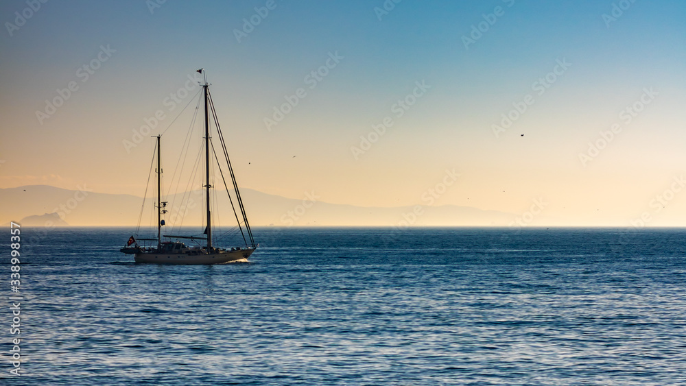 Lonely Boat on the Sea, Islands Background, calm weather