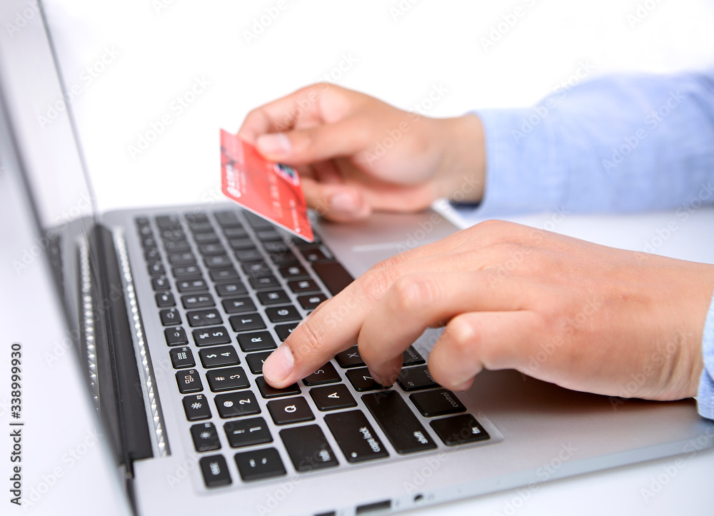 Hands with keyboard and credit card Hands with keyboard and credit card