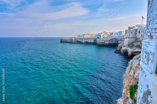 Houses on dramatic cliffs over Adriatic Sea On A Sunny Autumn Day At Polignano a Mare- Apulia - Italy