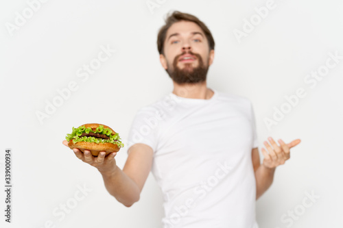 Man in white t-shirt hamburger fast food diet