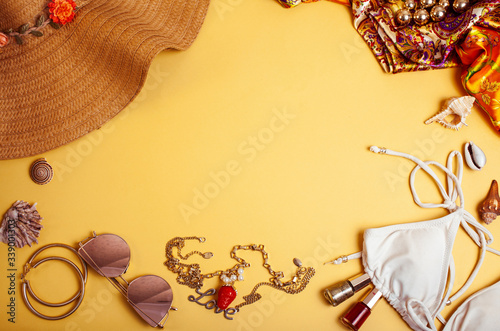 diverse travel girlish stuff on colorful background blue and yellow, nobody tourism lifestyle concept