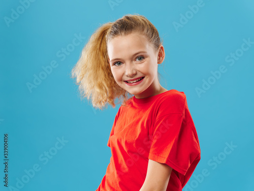 Cheerful girl smile studio curly hair blue background