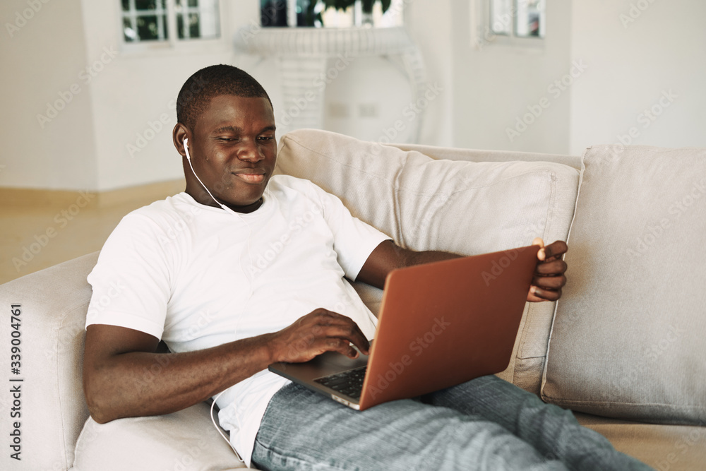 young man using laptop young man using laptop