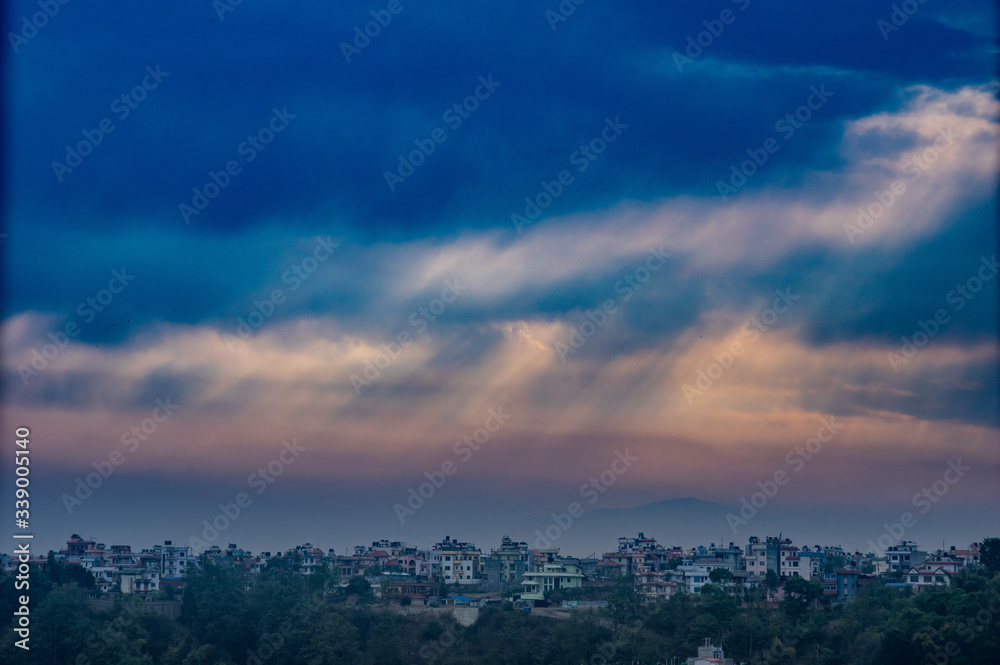 Fototapeta premium Sunrays Shining through the Morning Storm Clouds
