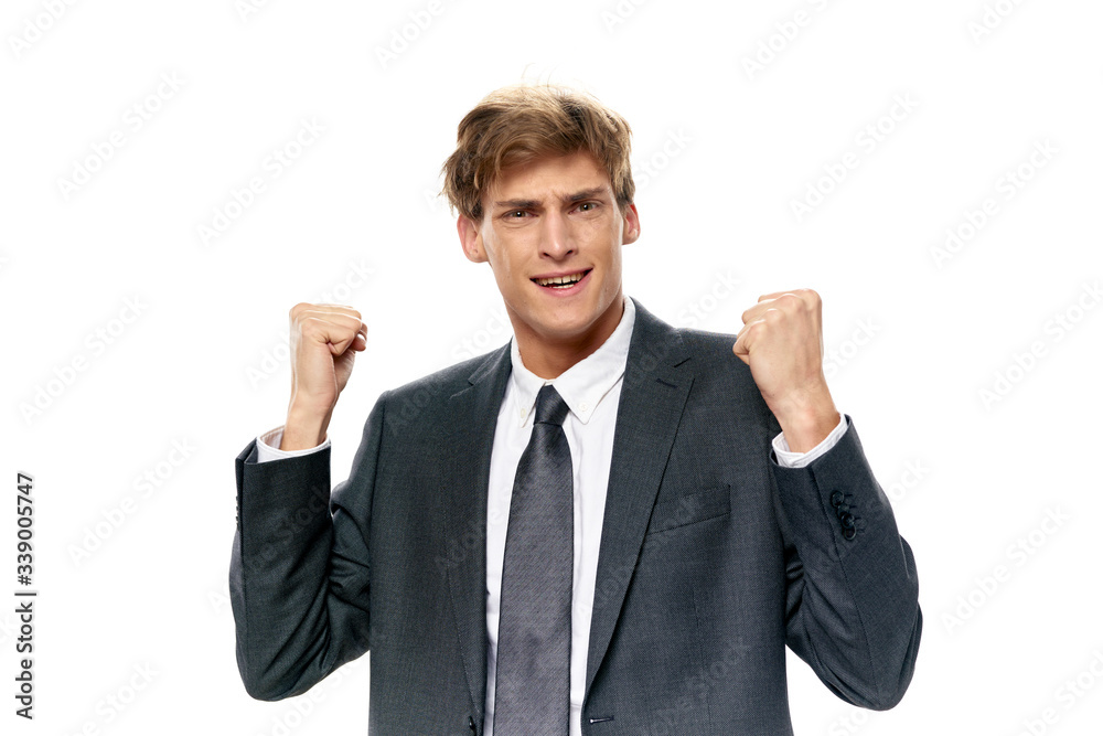 young businessman with arms raised young businessman with arms raised