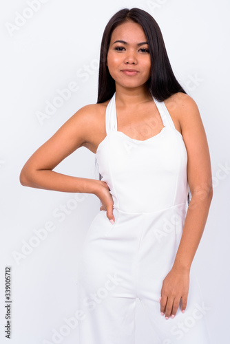 Portrait of young Asian businesswoman looking at camera
