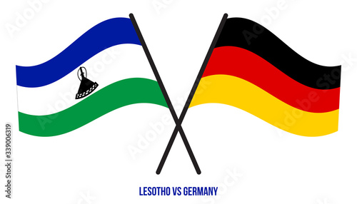 Lesotho and Germany Flags Crossed And Waving Flat Style. Official Proportion. Correct Colors