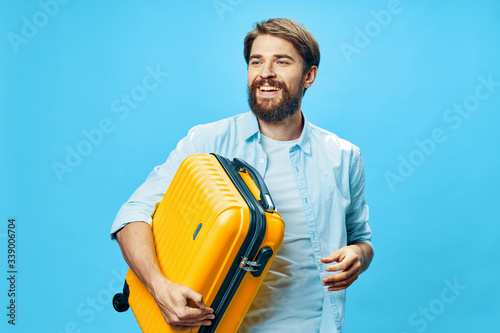 A man with a suitcase go on a trip on an isolated background