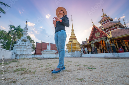 Asian woman with Wat Pong Sanuk background photo