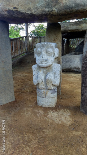 An ancient dolmen with anthropo-zoomorphic sculpture of a monkey at Colombian San Agustin archaeological park. antique pre columbus culture. 