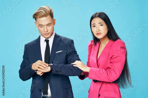 Man and woman officials work colleagues blue background