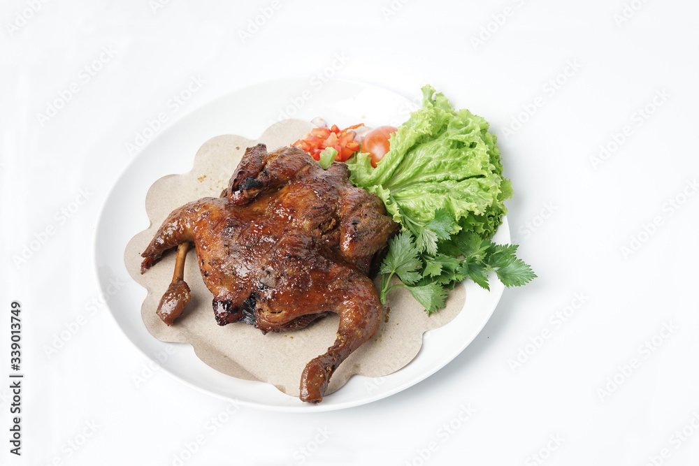 Whole grilled chicken Idonesia homemade tradition festival food isolated on white
