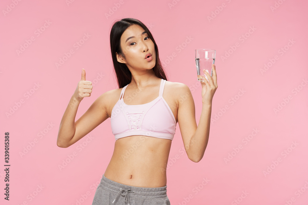 Emotional girl with hands up on a blue background Emotional girl with hands up on a blue background